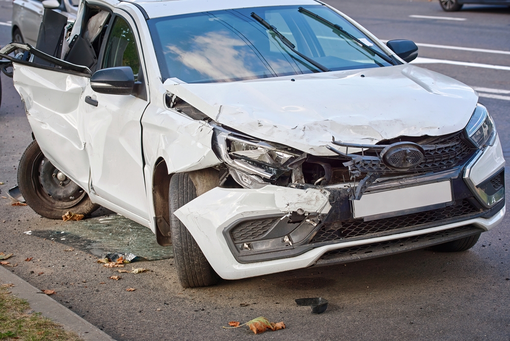 Severely damaged , broken headlights after road incident